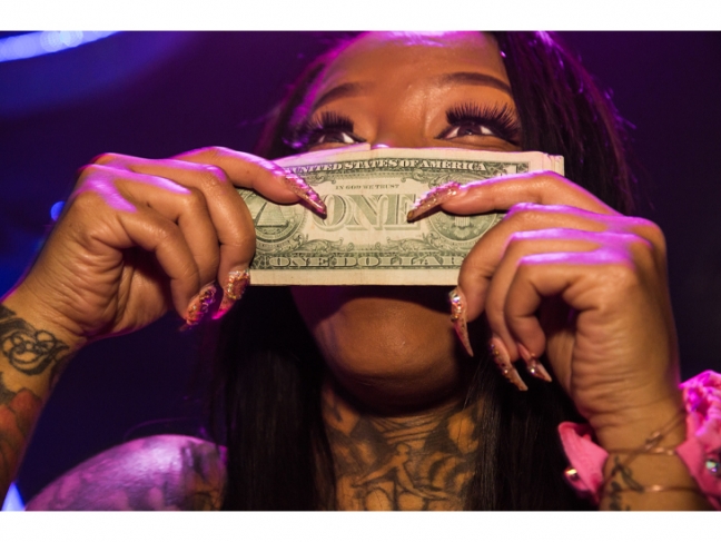 © Lauren Greenfield. Secret Moneii, 28, a stripper at Magic City who made nearly $20,000 during her first week at the club, Atlanta, 2015. Before coming to Magic City, the single mother of two was working two jobs and struggling.<br />

Credit: Lauren Greenfield/INSTITUTE