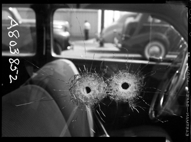 Unknown.
Close up of bullet holes in car window Atty. Murder. 
10.10.1942.
Gelatin silver print.
Courtesy Fototeka Los Angeles