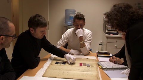 Raf Simons and Pieter Mulier review fabrics from Dior’s first collection at the archives. Credit: CIM Productions